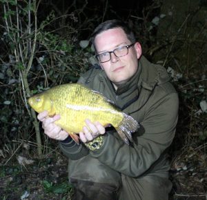 Scott Poulter displays his 4 lb 3 oz crucian from Johnsons Lake.