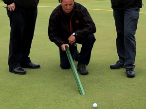 What is a stimpmeter and how does it work?