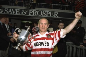Shaun Edwards of Wigan holding the trophy celebrates his team's victory