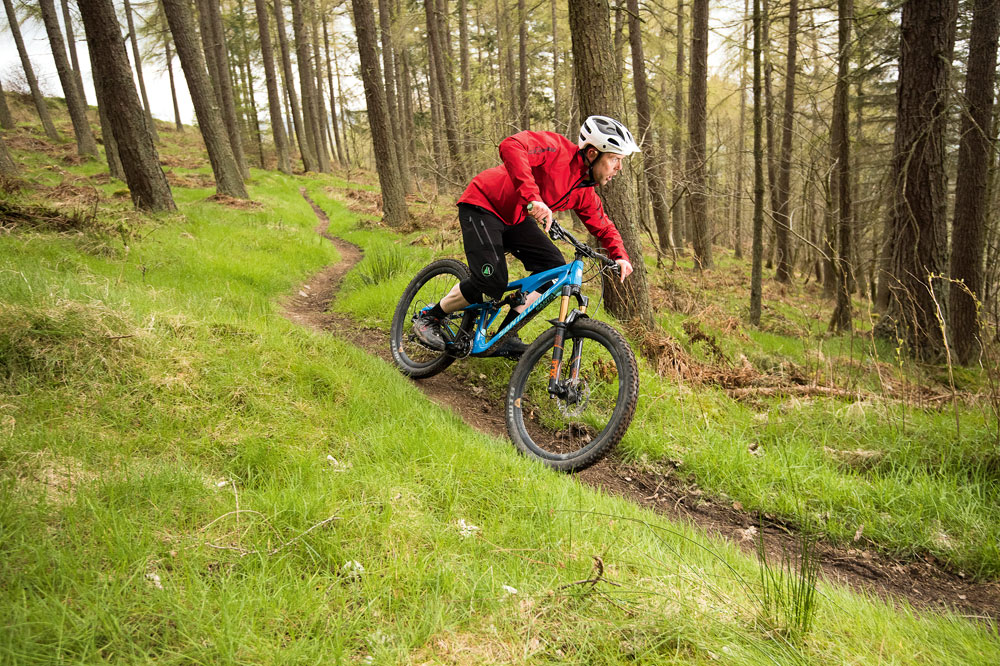 Notice how close Andy is to the bike here. It means that he can either generate grip through straightening his legs, forcing the tyres in to the ground, or even push harder if he feels he can trust the grip, meaning he can exit with more momentum.