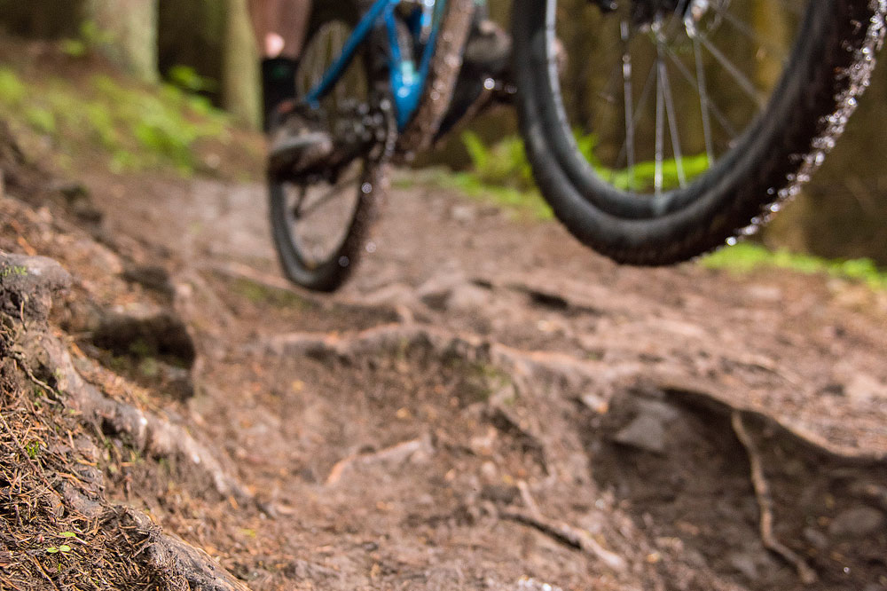 Andy has started off low and close to his bike here, meaning that once the trail gets slippery he can be light and already aiming to come back down where it’s safer.