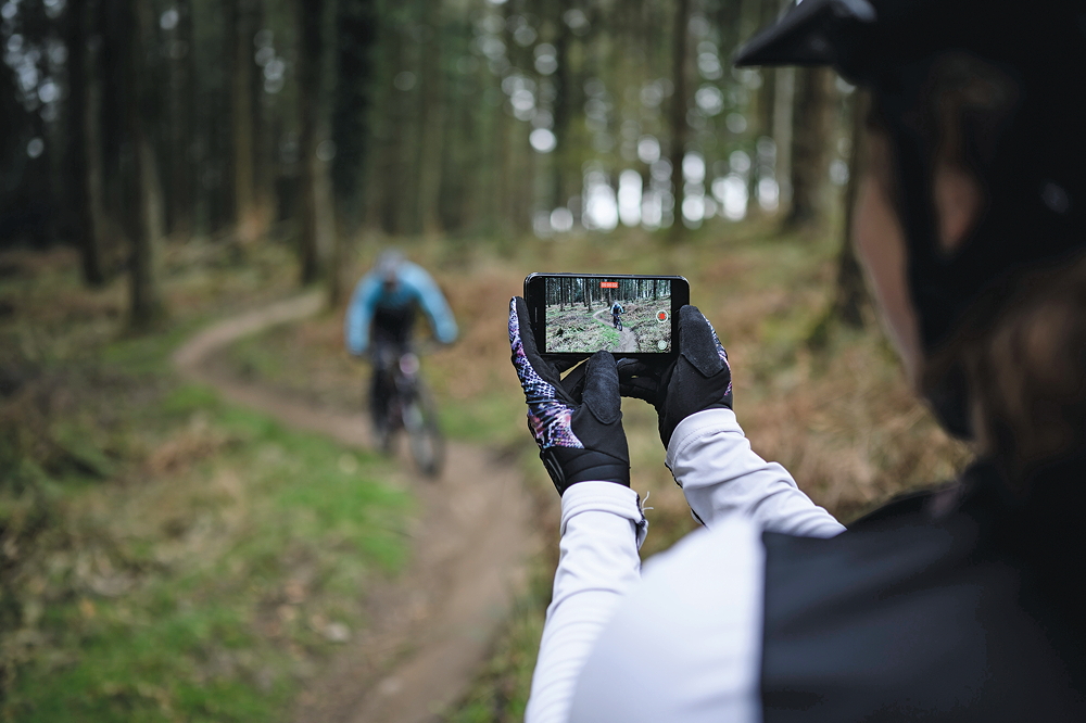 Filming a mountain biker on a smartphone