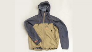 Photo of the front of the Leatt AllMtn waterproof MTB jacket in grey and sand colours