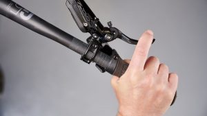 Hand on lever of mountain bike disc brake