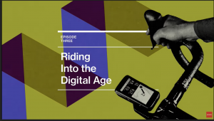 Green background with photo of handlebars and bike computer, with text reading 'Riding into the digital age'