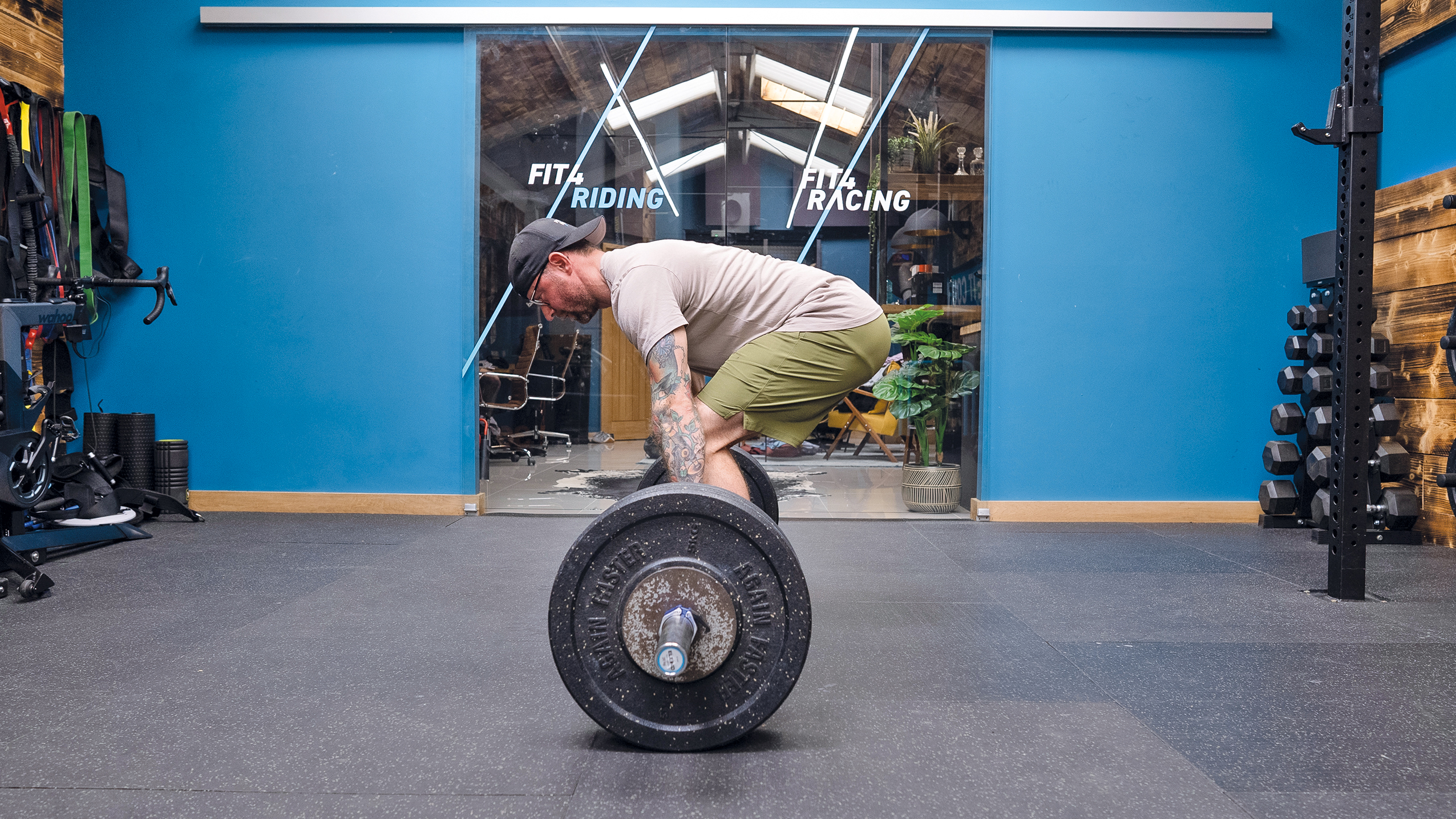 Man doing a deadlift with barbell