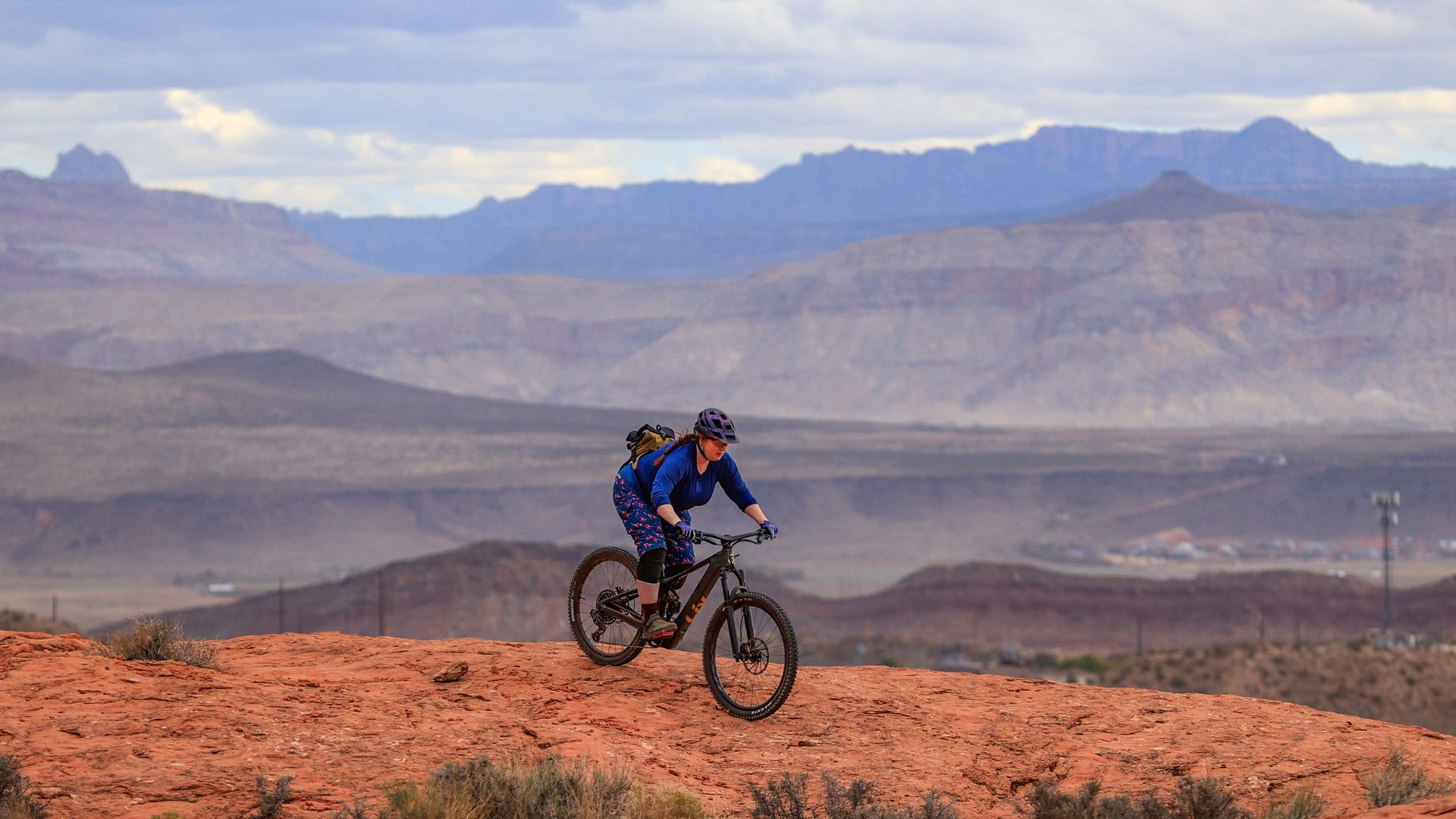 Woman rides the Liv Intrigue Advanced X E+ electric mountain bike