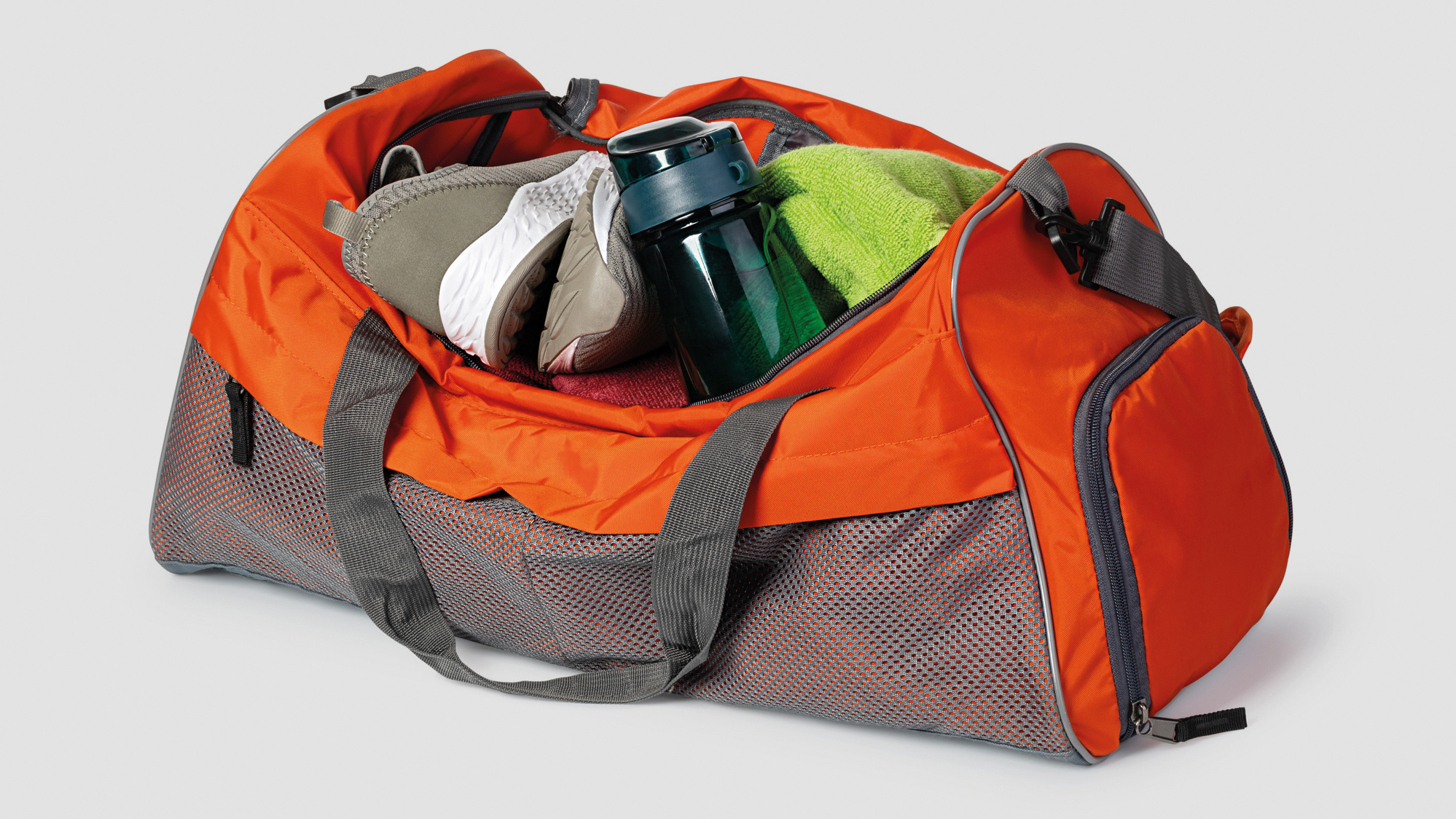 Sports bag with sports equipment Isolated on white background