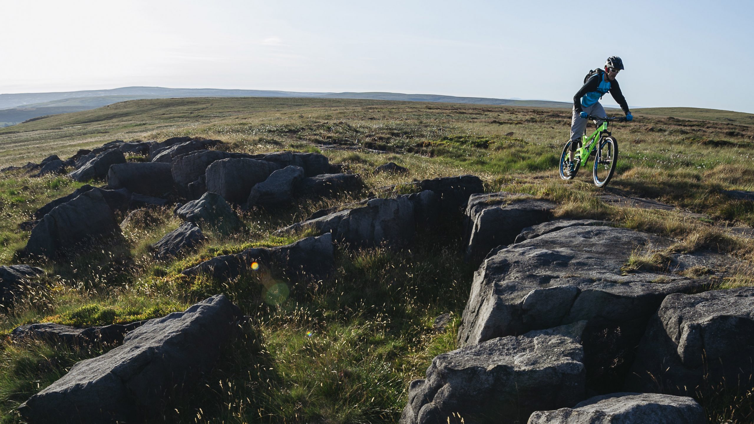 Mountain biker riding over rocks