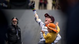 Rachel Atherton and her child celebrate victory at Lenzerheide DH World Cup 2023