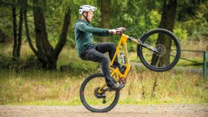 Learning how to do a wheelie on a mountain bike