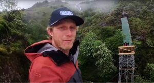 Bernard Kerr stands at the end of the new canyon gap takeoff, at Hardline Wales