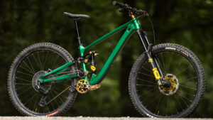 Hope's HB.916 enduro bike in green, picked out by the evening light