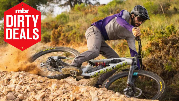7Mesh Glidepath MTB pants being worn by rider on a downhill trail, with MBR deals logo