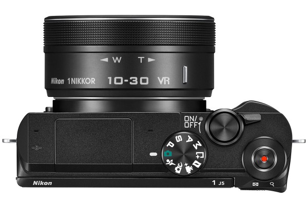 The 1 J% is a deceptively small camera. This view may look like it has a fat lens on it, but in fact its 10-30mm kit zoom is 58mm in diameter and little over an inch long