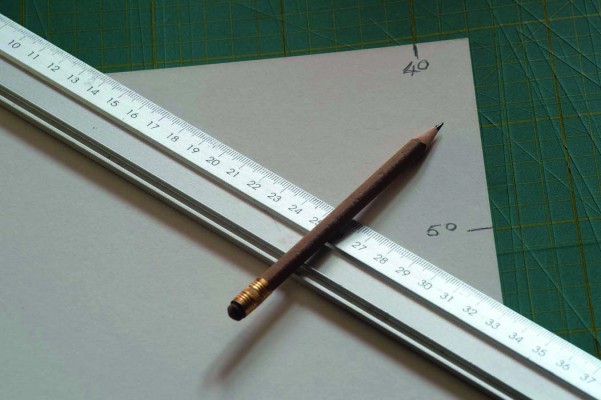 3. Mark The Board For Cutting - You can just about see how the clear lines on the Rotatrim cutting mat make it much easier to measure and to cut. One side is metric, the other is imperial. Cutting mats can be bought in a range of sizes depending on your needs. They really are one of the most useful tools you can have.
