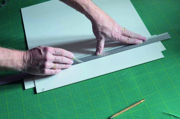 4. Cutting The Board - Some scrap card under the mount saves cutting into the Rotatrim mat and prolongs its valuable life. Our cutting mat is about 15 years old. Most of the damage was incurred in the first five years before we started using the card like this. Obviously you want to do everything you can to preserve your tools.