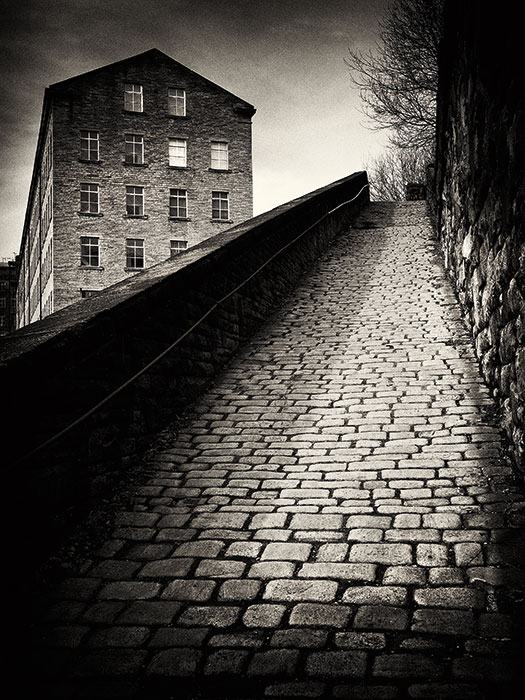 A less modern scene, like this street in Halifax, West Yorkshire, suits the black & white treatment (Olympus OM-D E-M5, 20mm, 1/60sec at f/8, ISO 200, 0.6 ND soft grad)