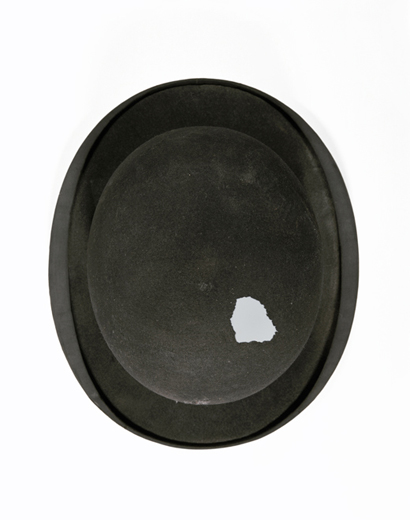 Bowler hat located in the same store room at the Institute of Legal Medicine as previous skull. Further details unknown.