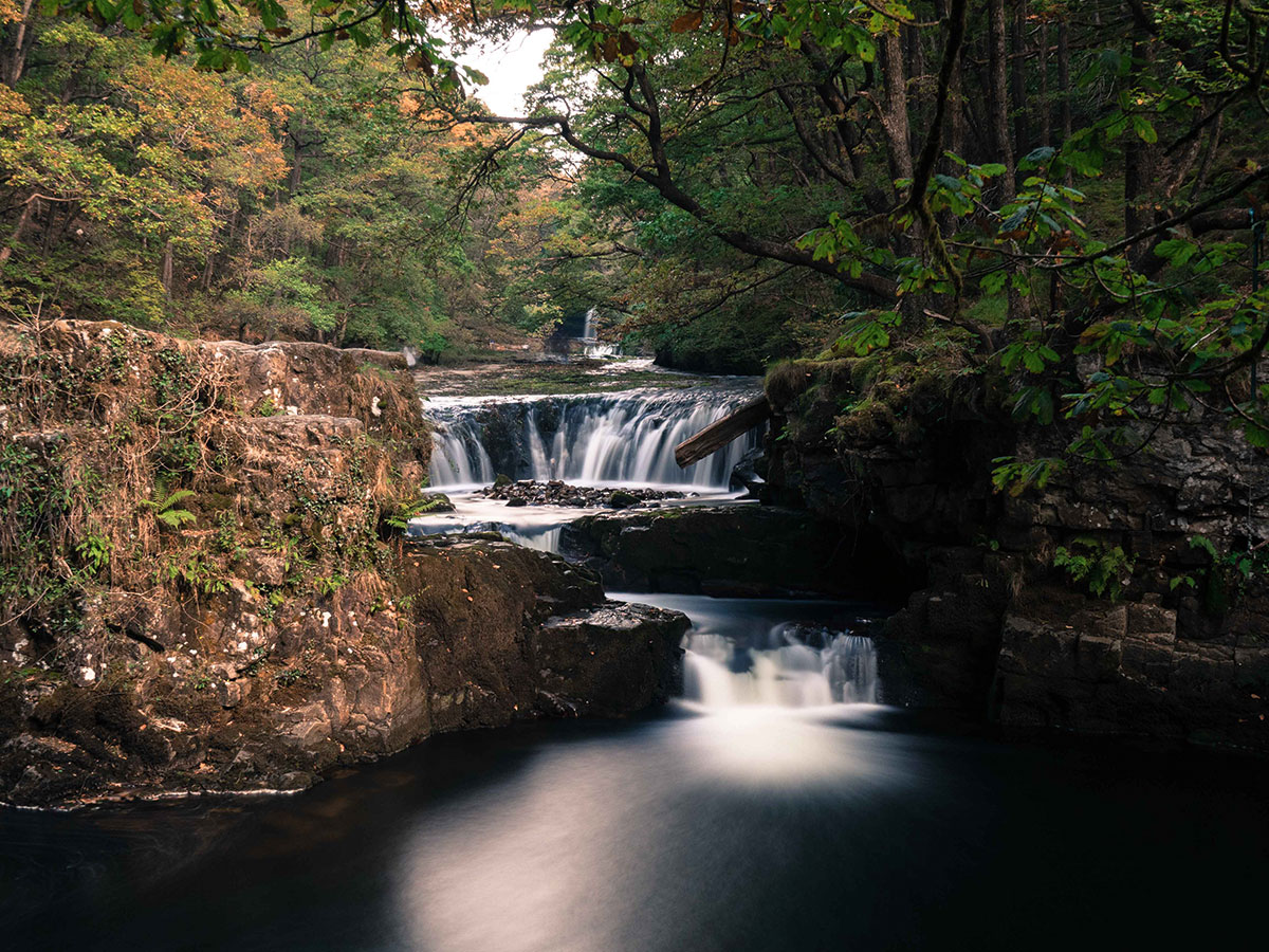 Before: The cliff face on the left is catching more light, detracting from the waterfall in the centre of the frame