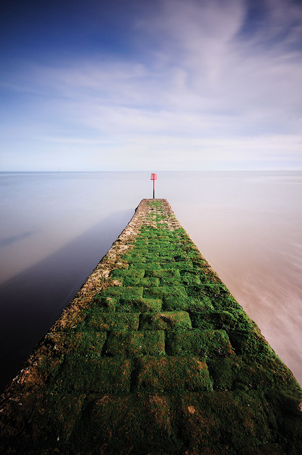A groyne stretching out to sea at Dawlish, Devon