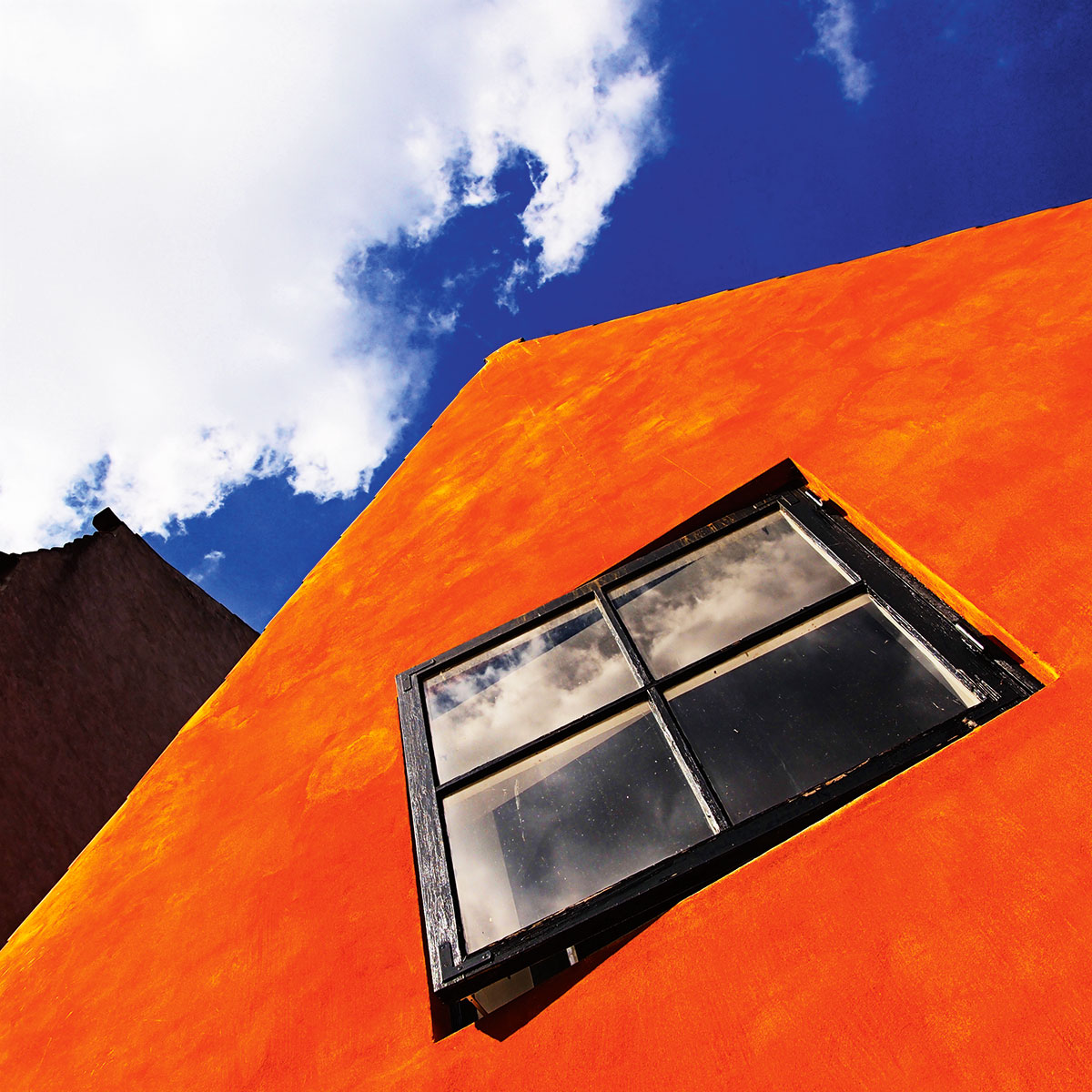 Use a polarising filter to boost colours and reduce the number of reflections in the scene