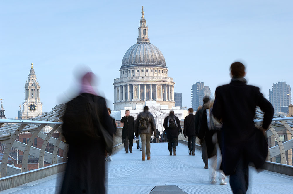 Commuters crossing the Millennium Bridge