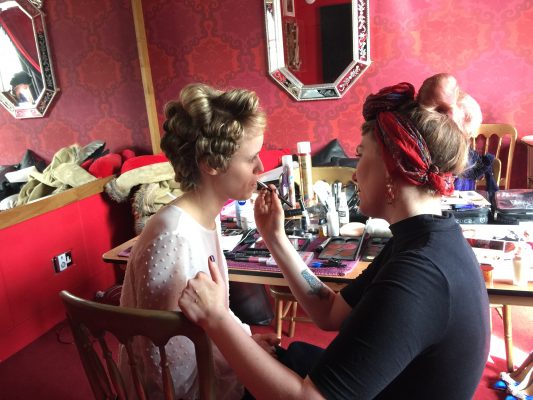 Make up artist Stacie Smith applies make-up to model Angel White