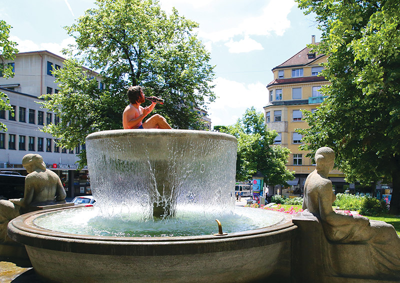 Street photography man in fountain
