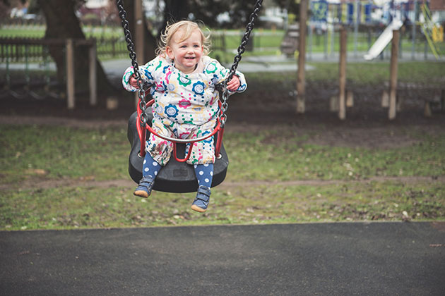 Portrait child on swing