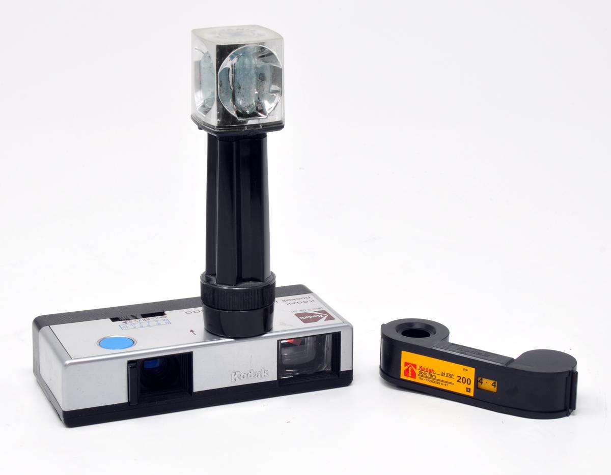 An early Pocket Instamatic 300, pictured with a 110 film cartridge and fitted with its flashcube extender, to help eliminate redeye when shooting with flash - 110 film cameras