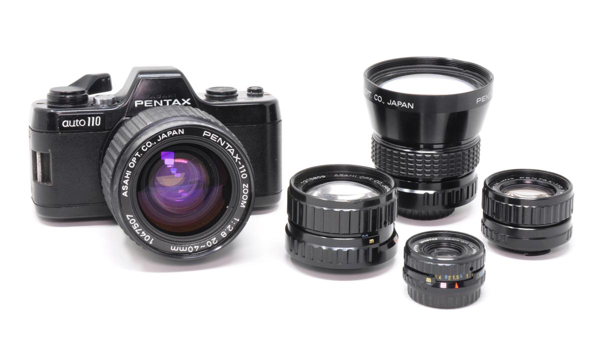 Pentax Auto 110 with 20-40mm zoom lens fitted, plus 24mm standard, 18mm wideangle, 50mm and 70mm telephoto lenses - 110 film cameras