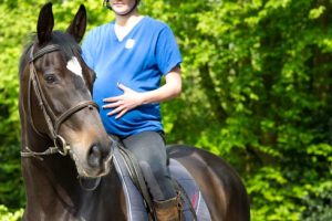 A pregnant lady rider