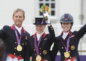 British dressage team on the podium receiving thier medals