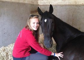 Chloe Vell in the stable with Kaja