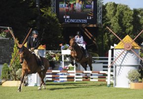 Peter Charles giving Britain's Karen Law (who is blind) and Glad Tiding II a lead and verbal direction in the Epreuve Handisport Cap Atlantique Grade 4 class at La Baule