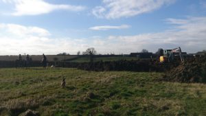 Quorn hunt next to a digger at Lauren Shannon's new yard