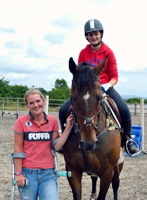 Woody being ridden by Phoebe