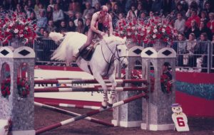 London Horse Show fancy dress - John Whitaker in action