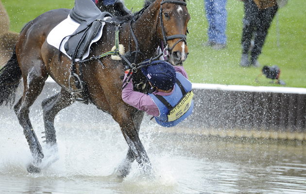 James Robinson and Comanche take a rather wet fall . Comanche has other ideas about continuing the trial !