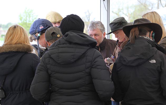 Pippa Funnell being interviewed ina busy mixed zone