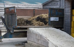 muck heap with trailer and ramp