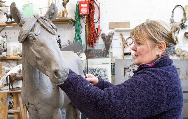 Judy Boyt crafting the clay maquette of World Horse Welfare May