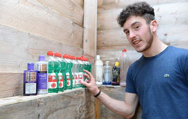 Zak Vaughan-Jones with his washing-up liquid at Sarah & Simon Parker's yard at Glebe Farm in Bronington near Whitcurch in Shropshire, UK on the 1st March 2016
