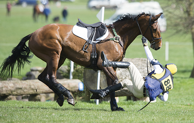 Euan Hammersley and Dionysus N fall during the Novice class at Weston Park Horse Trials - Weston Park, Shifnall, Shrophire, United Kingdom - 11 April 2015