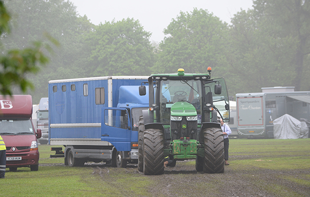 Water-logged and muddy areas around the stables and lorry park for the carriage drivers during Wednesday of the Royal Windsor Show, in the grounds of Windsor Castle in Windsor in the county of Berkshire, UK on 11th May 2016