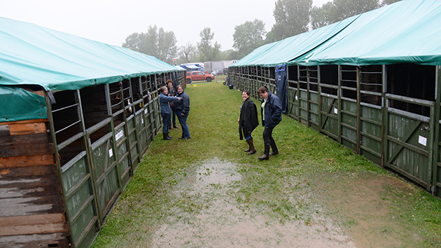 weather rain called off abandoned Water-logged and muddy areas around the stables and lorry park for the carriage drivers during Wednesday of the Royal Windsor Show, in the grounds of Windsor Castle in Windsor in the county of Berkshire, UK on 11th May 2016