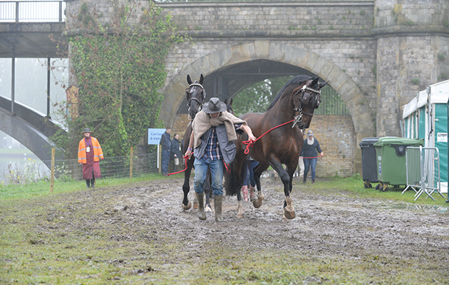 Water-logged and muddy areas around the stables and lorry park for the carriage drivers during Wednesday of the Royal Windsor Show, in the grounds of Windsor Castle in Windsor in the county of Berkshire, UK on 11th May 2016