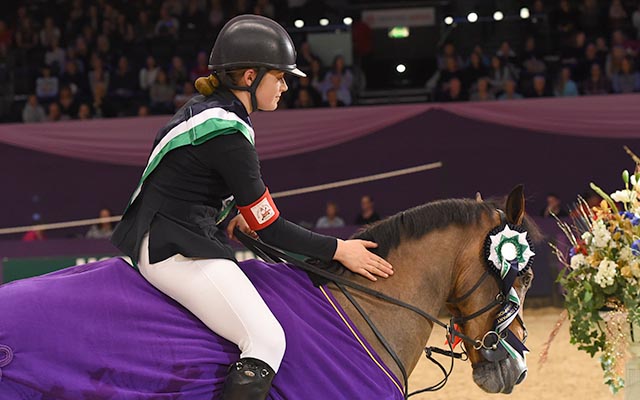Nicole Lockhead Anderson  riding SHAPPEN PILGRIM owned by Claire Lockhead, winner of the 138 cm Championship (Class 8) during HOYS in the NEC in Warwickshire in the UK on 8th October 2016