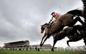 The Giant Bolster (nearside) ob way to winning at Cheltenham pic Bill Selwyn 25-1-14